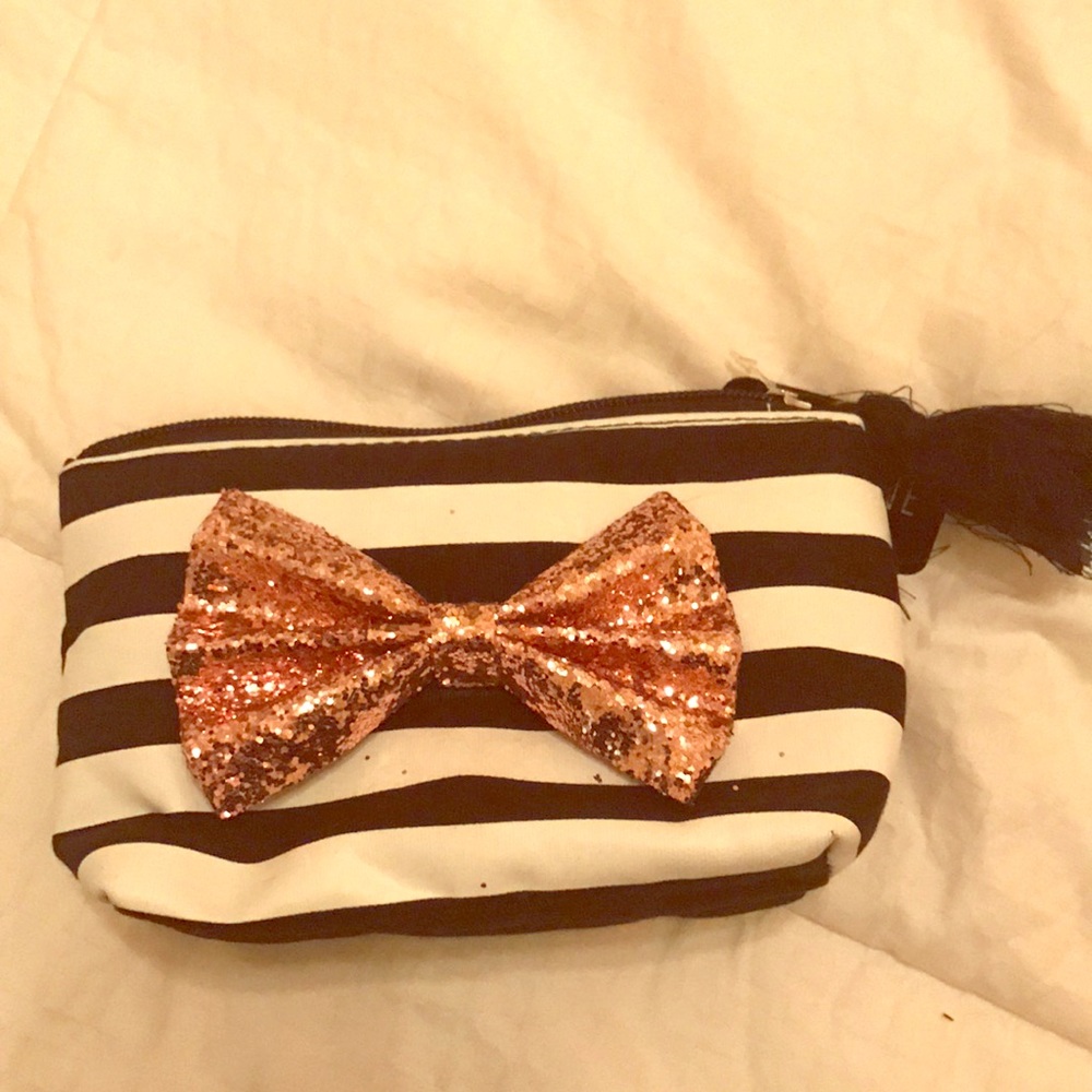 Cosmetic bag with rose gold bow and tassel